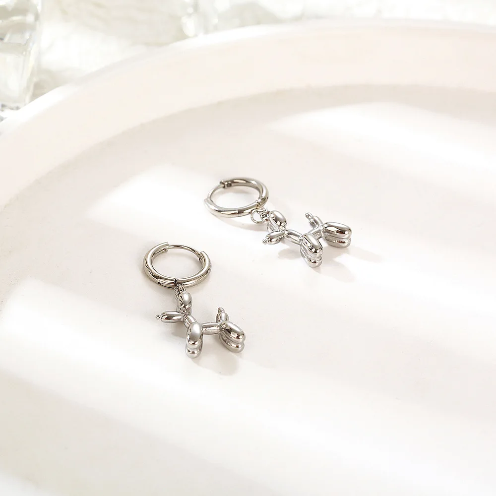 Gold Huggie Earrings with Mini Balloon Dog Charm - Image 3